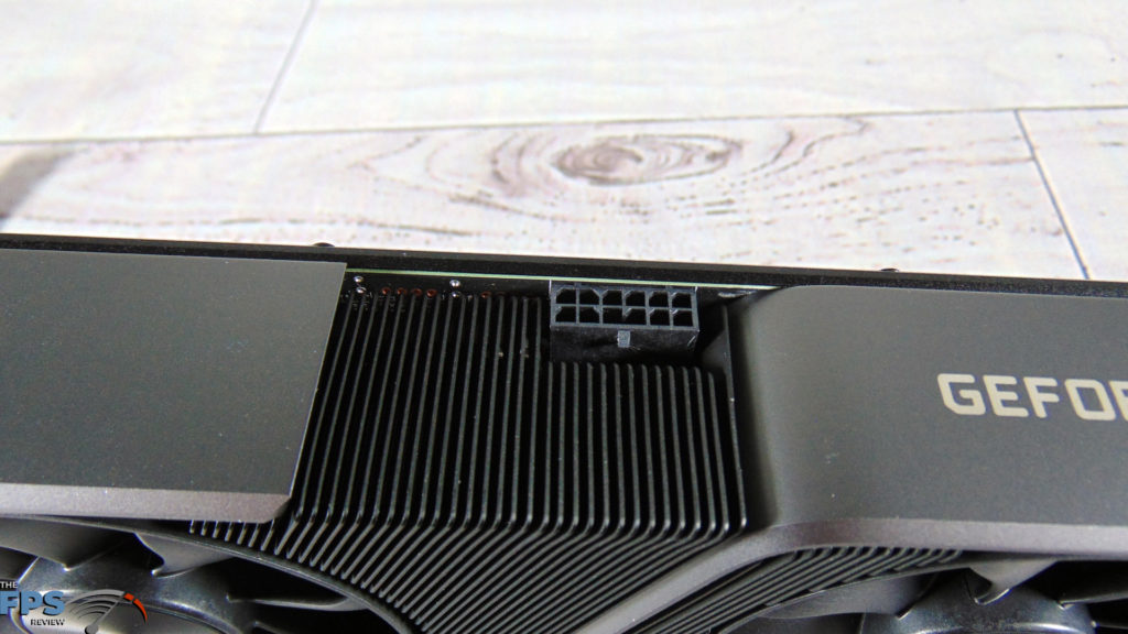 NVIDIA GeForce RTX 3070 Founders Edition video card closeup of 12-pin power connector on white background table