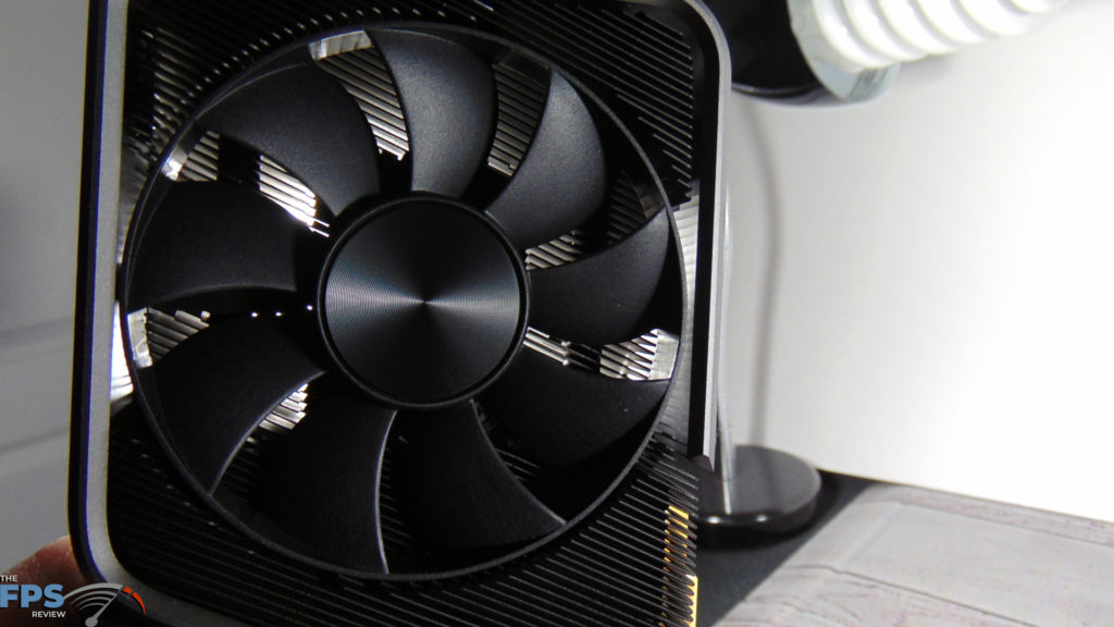 NVIDIA GeForce RTX 3070 Founders Edition video card closeup of pass through fan with light shining through on white background