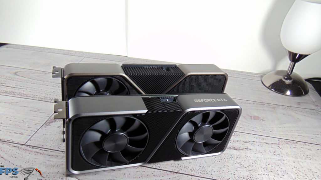 NVIDIA GeForce RTX 3070 Founders Edition and NVIDIA GeForce RTX 3080 Founders Edition on table standing up size comparison