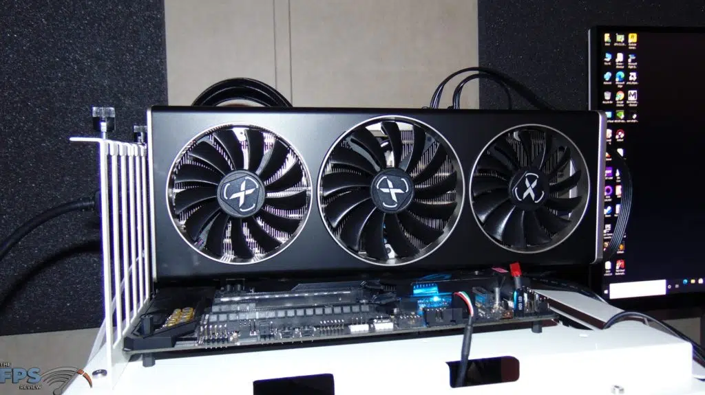 XFX SPEEDSTER MERC 319 BLACK AMD Radeon RX 6700 XT installed in motherboard on testing bench front view