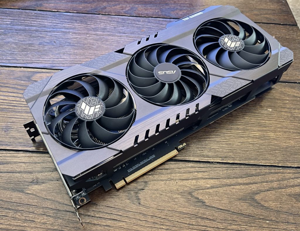 ASUS TUF Gaming Radeon™ RX 6700 XT OC Edition Flat and at a Tilt on hardwood table