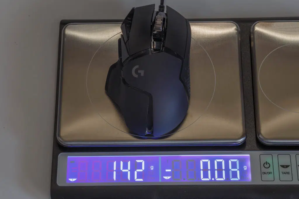 Logitech G502 HERO High Performance Gaming Mouse on scale with weights