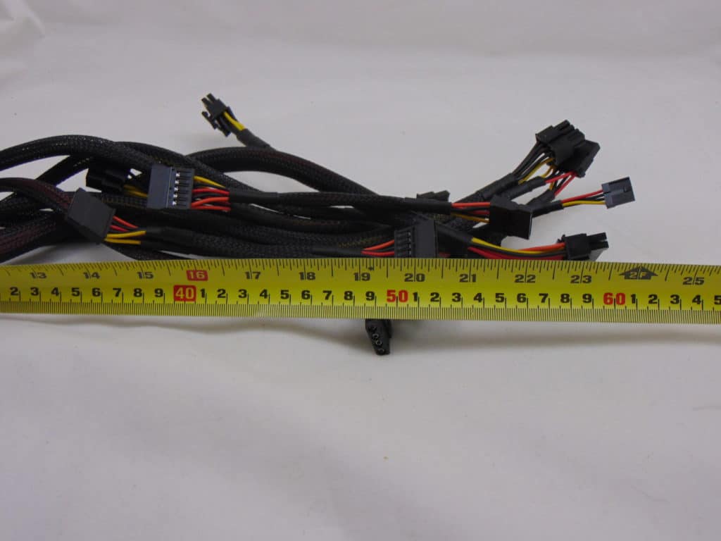 GIGABYTE P650B 650W Power Supply measuring cable length with ruler