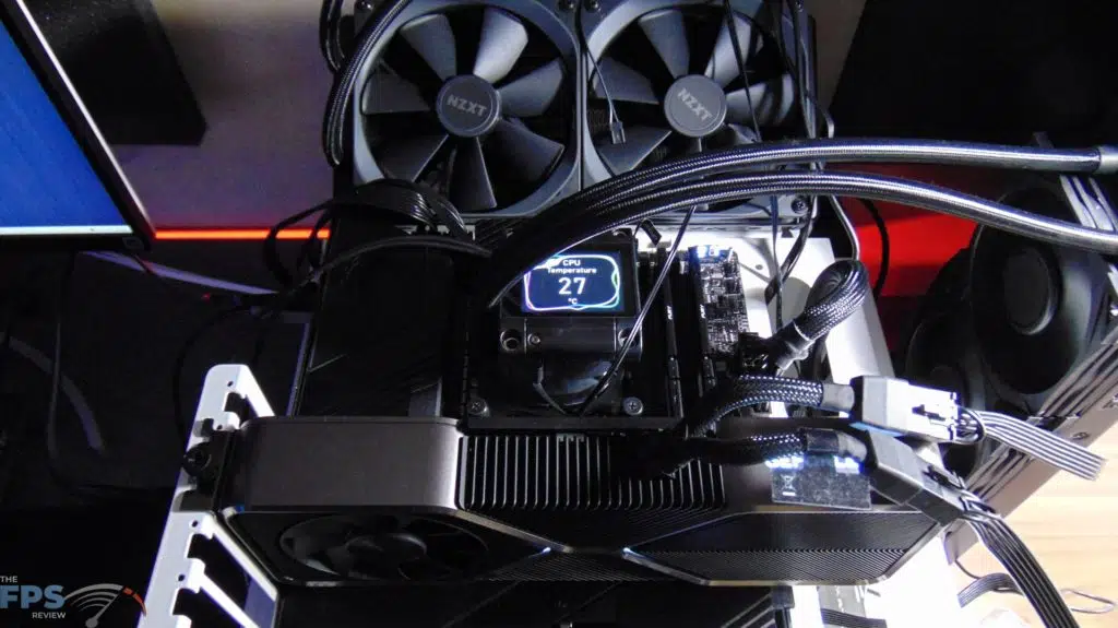 MSI MEG Z690 UNIFY Motherboard Top View with MSI MEG Coreliquid S360 AIO Cooler installed with LCD Screen Turned On