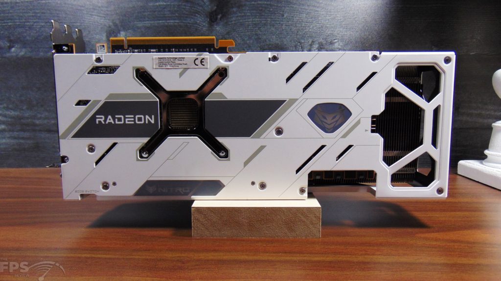 SAPPHIRE NITRO+ AMD Radeon RX 6950 XT PURE standing up on table back view