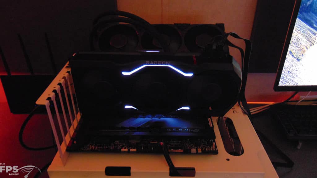 AMD Radeon RX 7900 XTX Video Card In Computer Top Angled View LED Lit Up