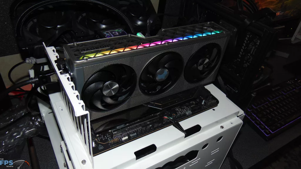 SAPPHIRE NITRO+ AMD Radeon RX 9060 XT Video Card Installed in Computer RGB Turned On